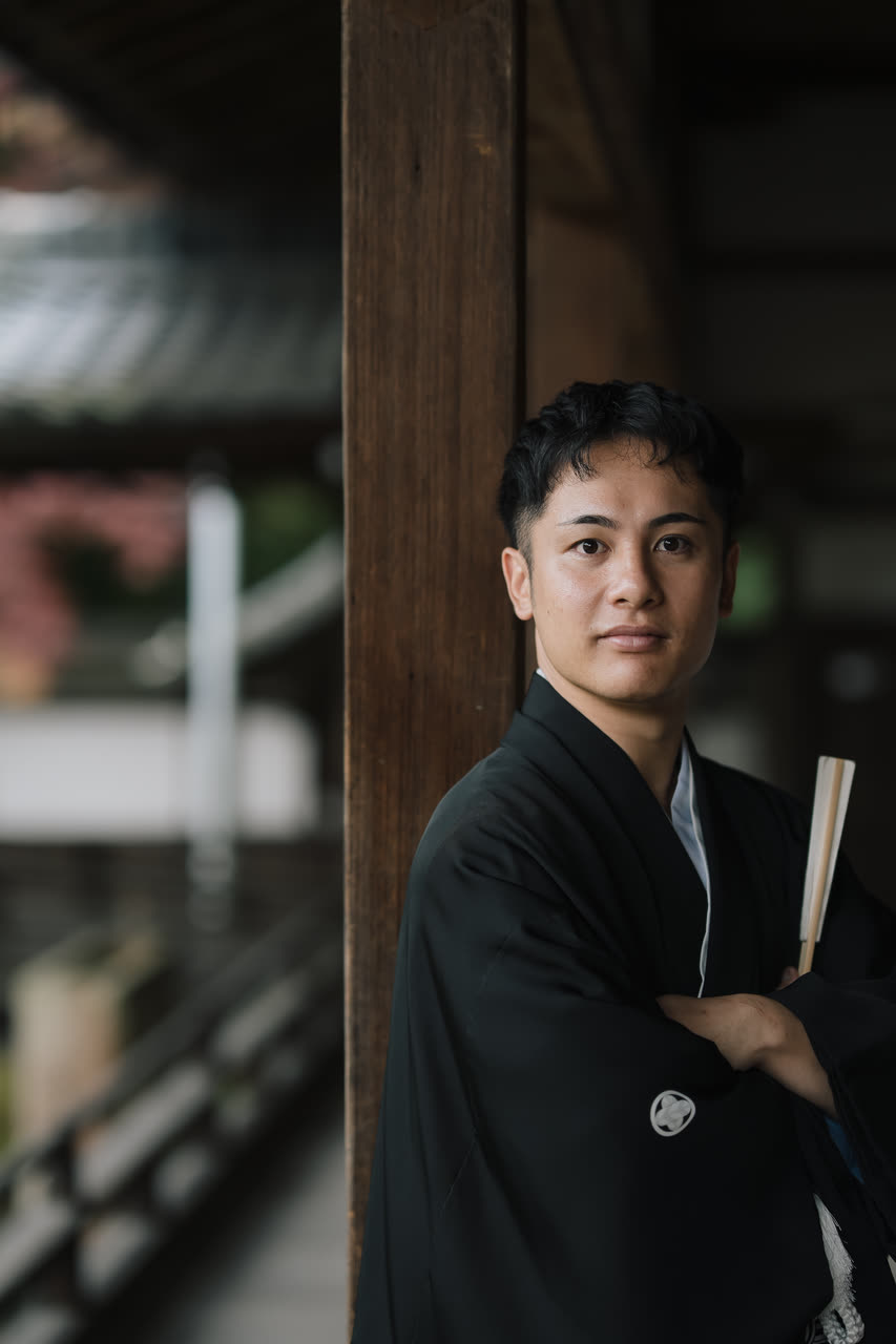 Groom in black montsuki haori hakama, the formal Japanese wedding outfit for men