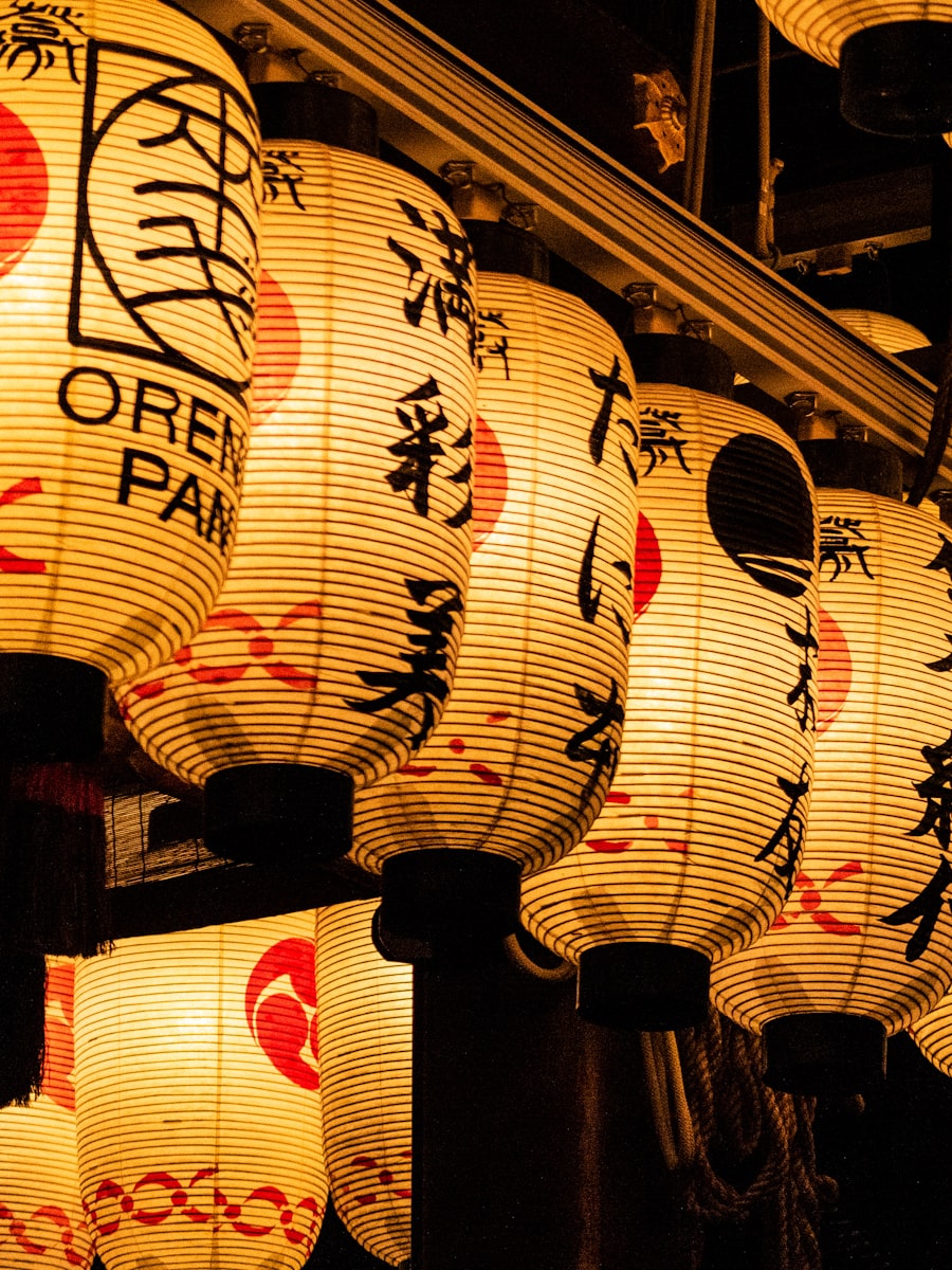 Historic stone lane in Kyoto lit by lanterns in the evening