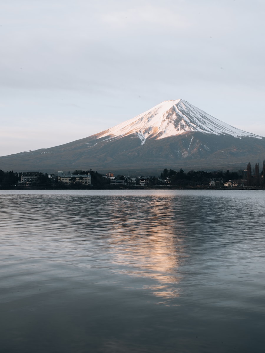 Mount Fuji reflected in a still lake on a calm morning